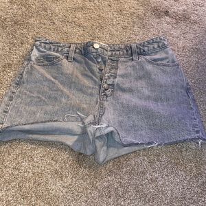 Cute grey jean shorts, ripped at the bottoms.